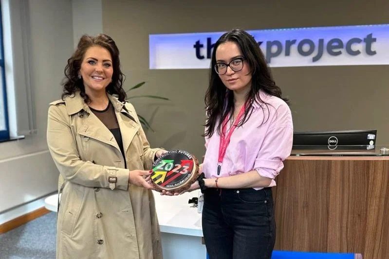 Thinkproject employee accepting construction industry award