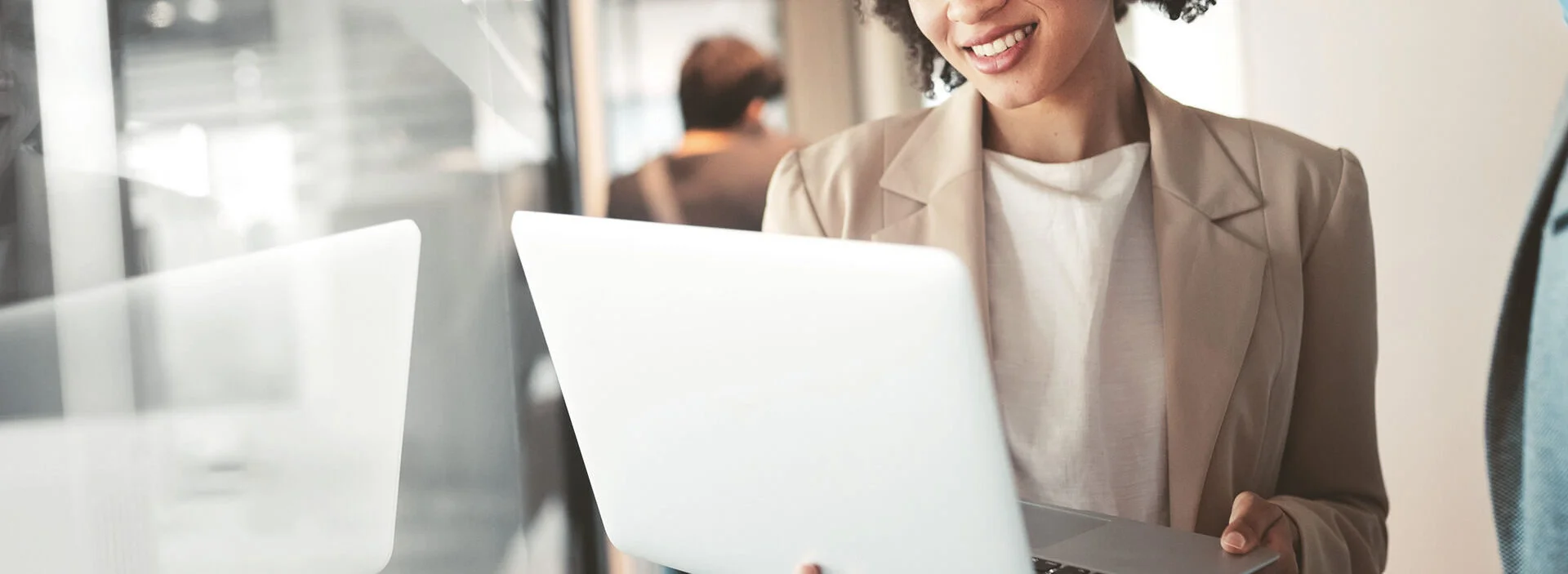 Two professionals looking at laptop