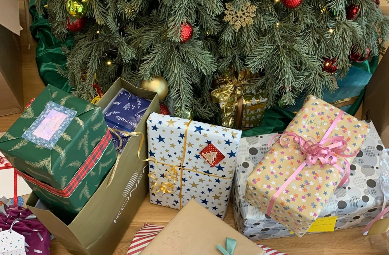 Christmas tree with gifts wrapped underneath