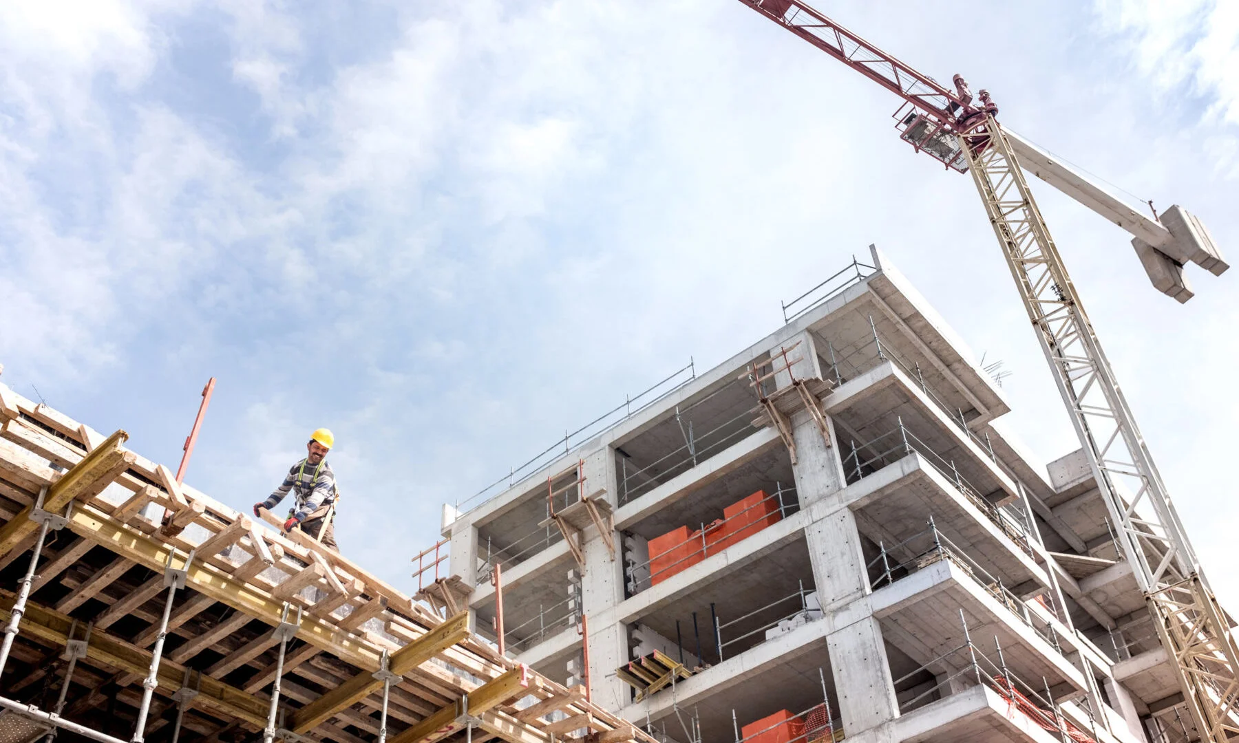 Construction worker on building roof