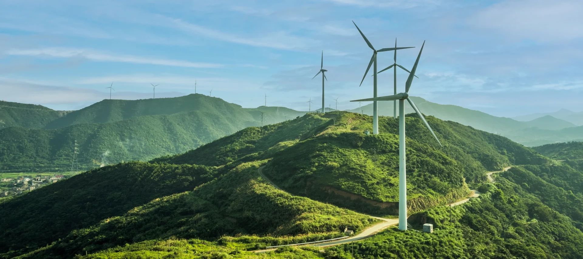 Landscape shot of mountains with windfarms