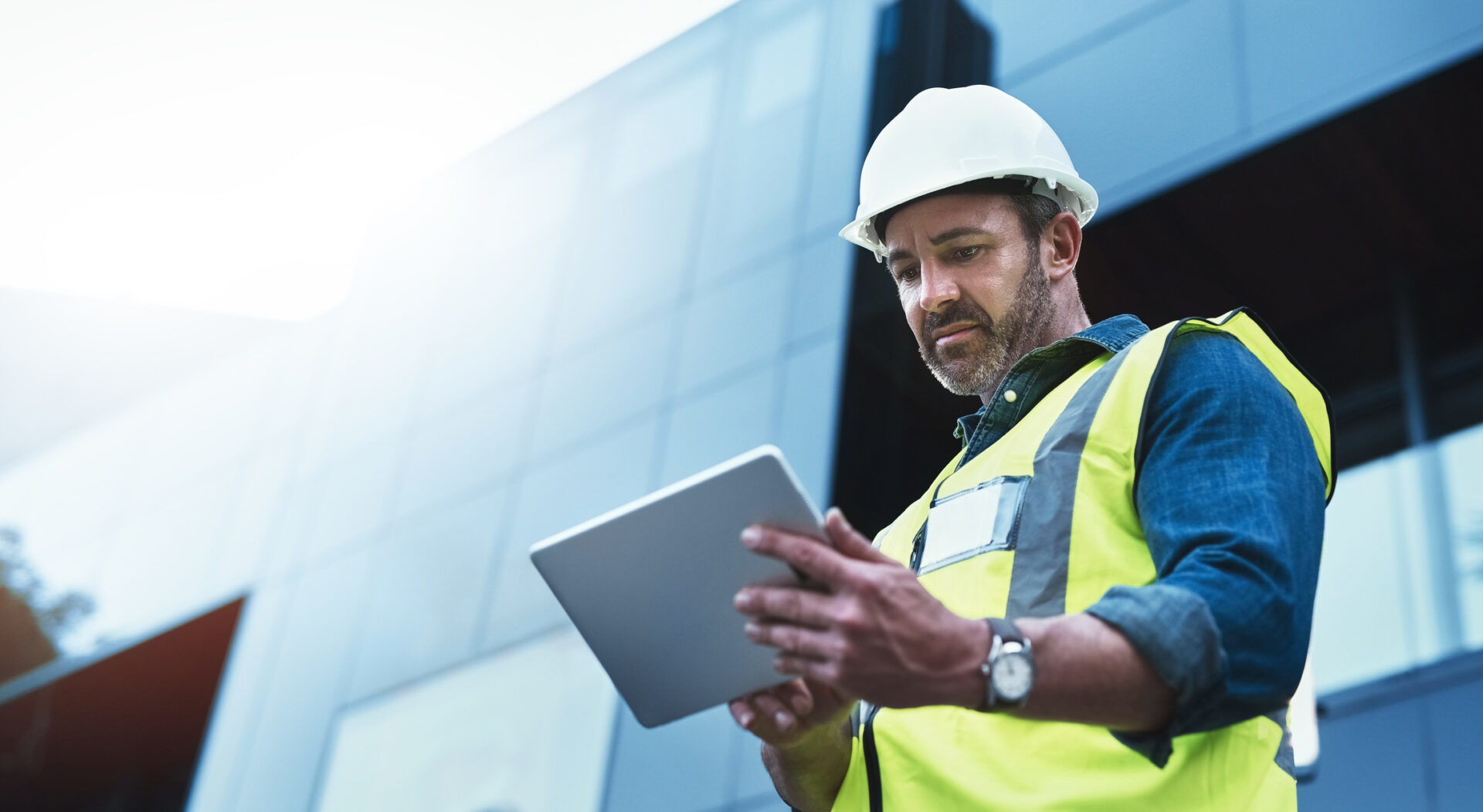 Construction professional using a tablet